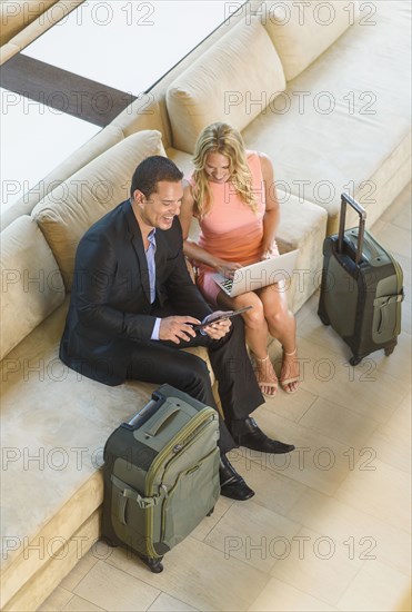 Overhead view of business people talking in lobby