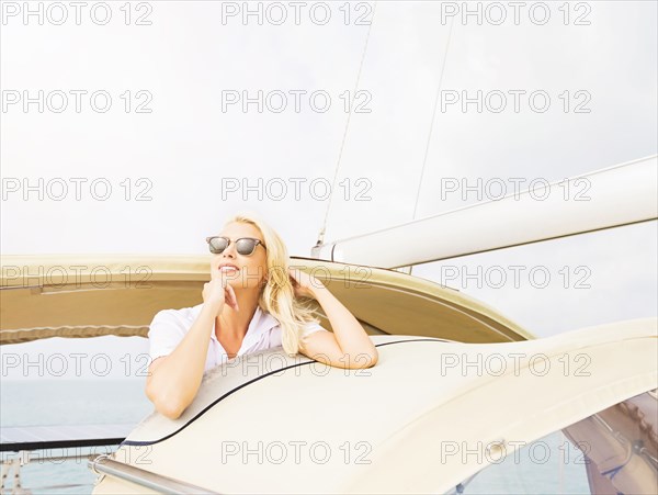 Woman in sunglasses sailing