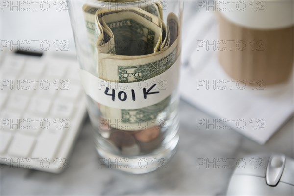 Close up of savings cup on office desk