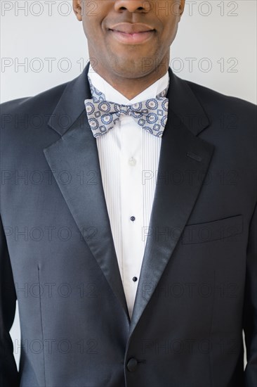 Close up of smiling groom wearing tuxedo