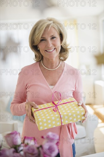 Caucasian woman holding gift