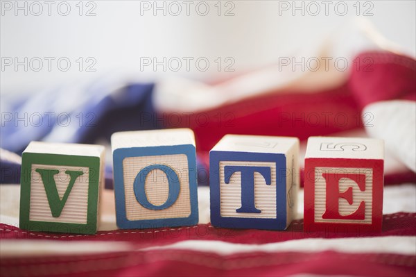 Close up of vote toy blocks on American flag