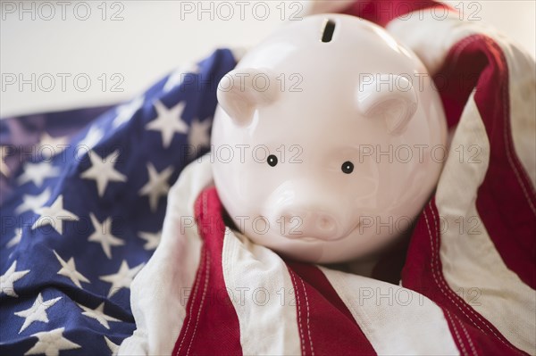 Close up of piggy bank and American flag