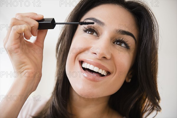 Close up of woman applying makeup