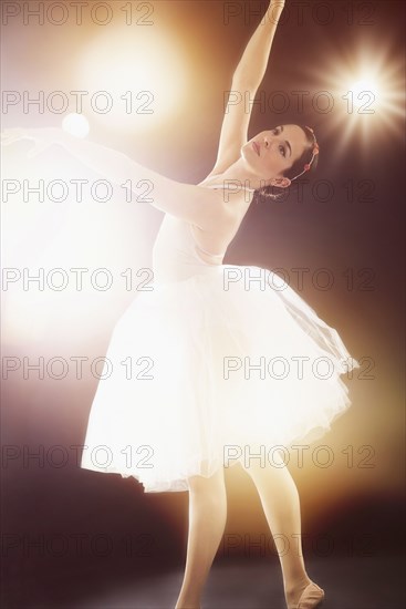 Hispanic ballet dancer performing on stage