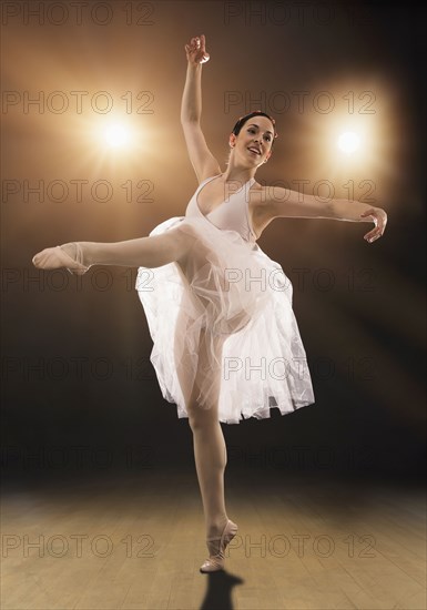 Hispanic ballet dancer performing on stage