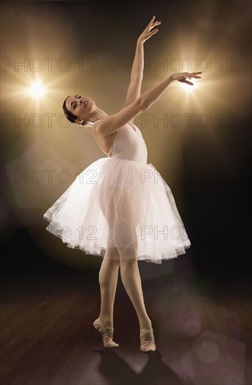 Hispanic ballet dancer performing on stage