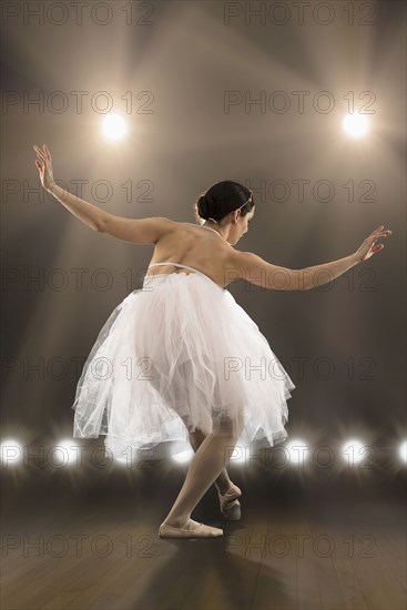 Hispanic ballet dancer performing on stage