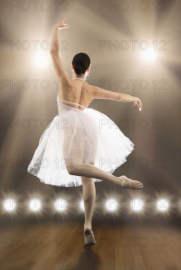 Hispanic ballet dancer performing on stage