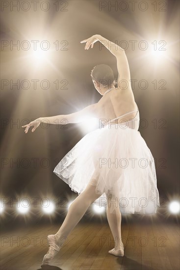 Hispanic ballet dancer performing on stage