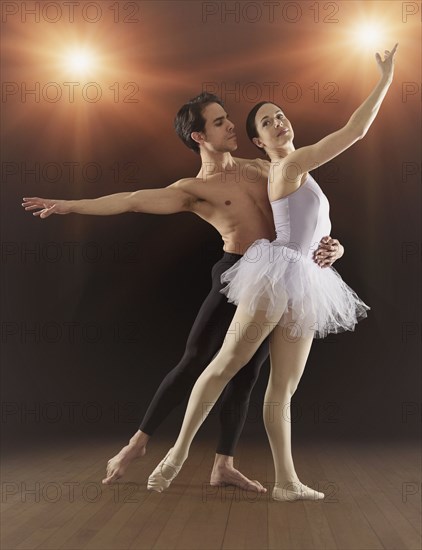 Hispanic ballet dancers performing on stage