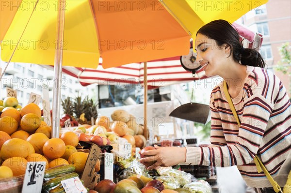 Hispanic woman shopping at farmers market