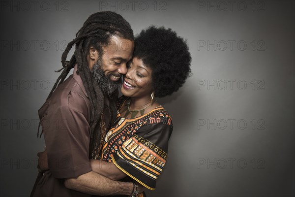 Close up of smiling couple hugging