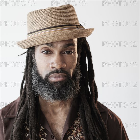 Close up of serious Black man with dreadlocks