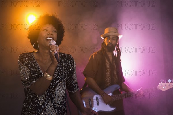 Singer and guitarist performing on stage