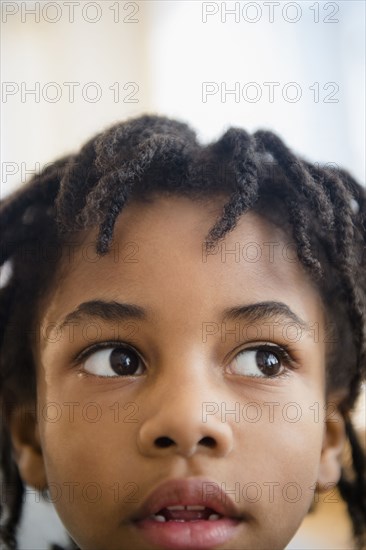 Close up of curious mixed race boy