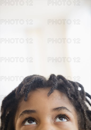 Close up of mixed race boy looking up