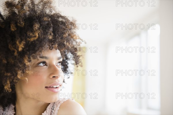 Mixed race woman looking up