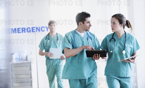 Doctors talking in hospital emergency room