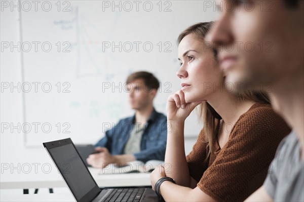 Student listening in college classroom