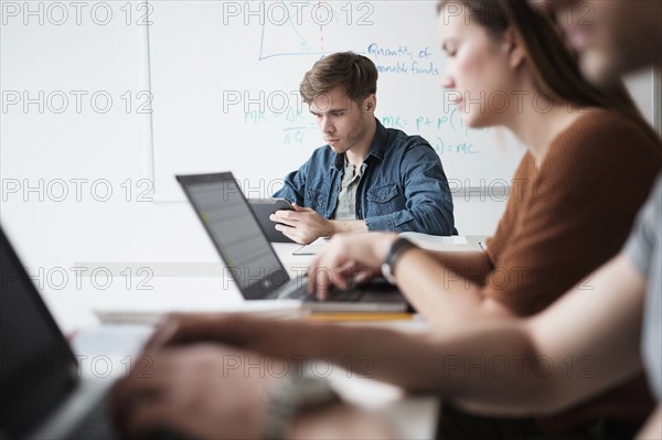 Students working in college classroom