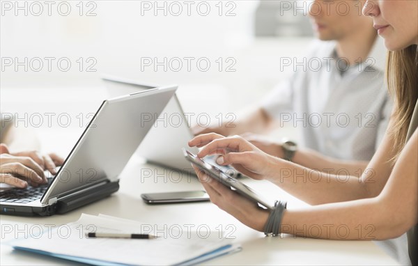 Business people using technology in office meeting