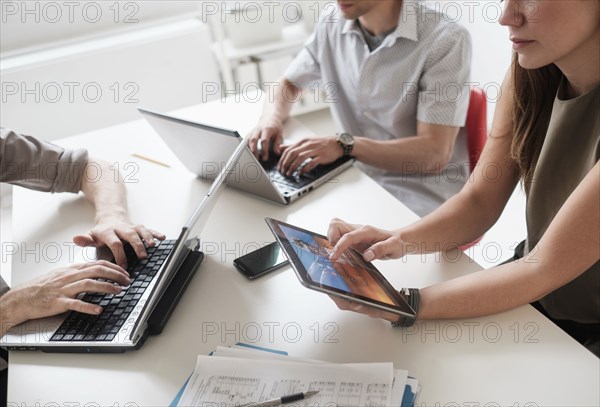 Business people using technology in office meeting