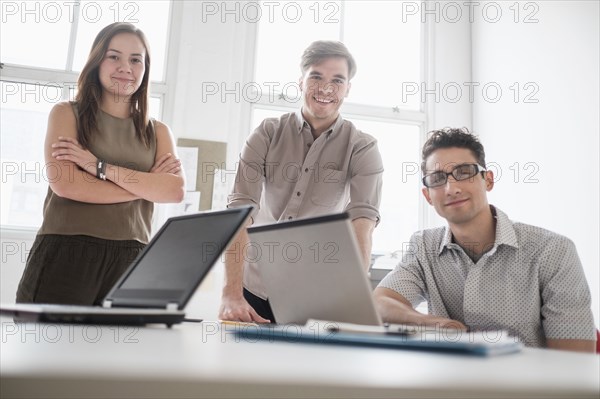 Business people with technology in office meeting