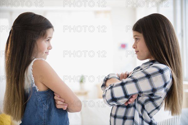 Caucasian twin sisters arguing