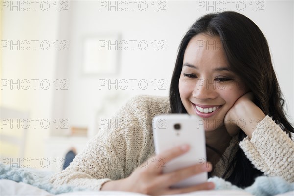 Chinese woman using cell phone