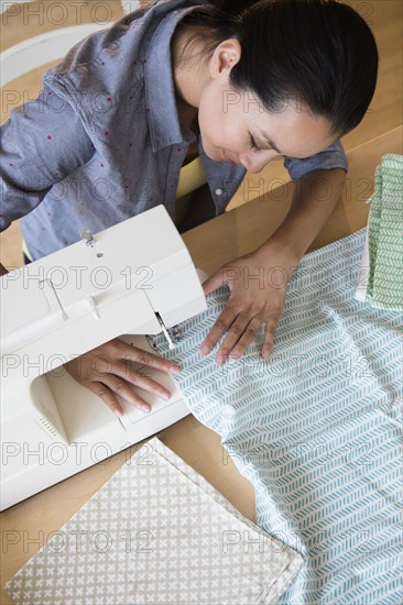 Chinese woman using sewing machine