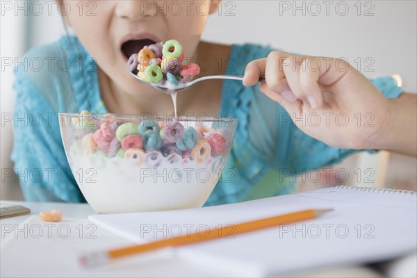 Girl eating bowl of cereal