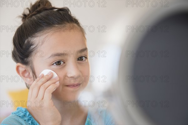 Girl washing her face