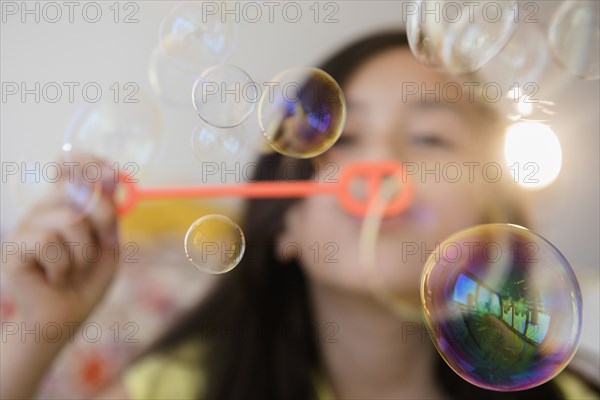 Girl blowing bubbles