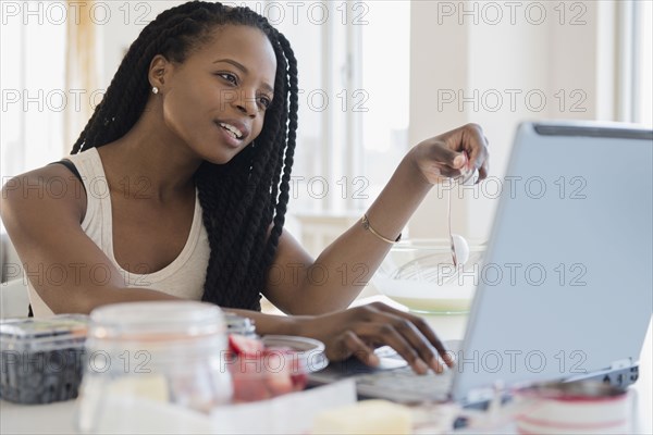 Black woman using laptop