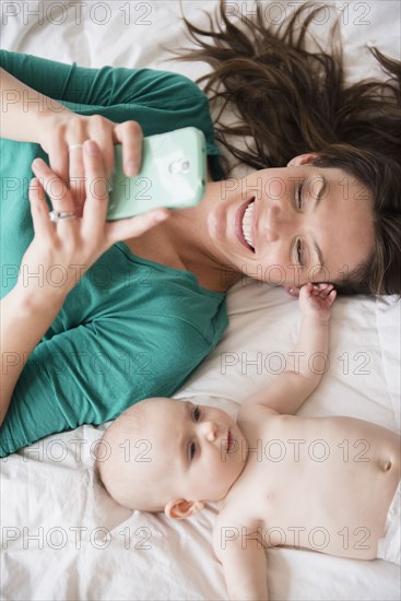 Mother taking selfie with baby daughter