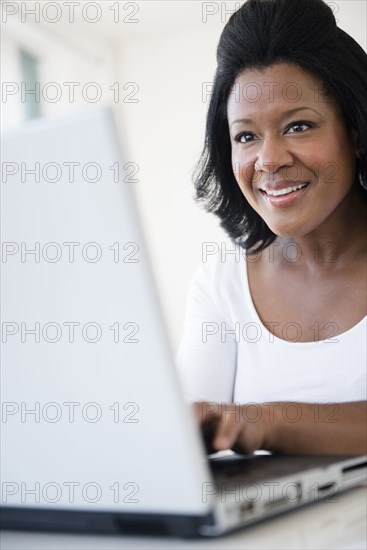 Black woman using laptop