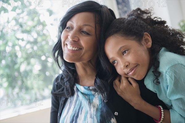 Mother and daughter hugging