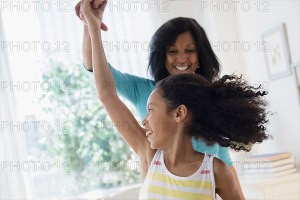 Mother and daughter dancing