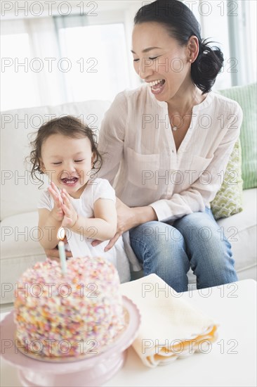 Mother and baby daughter celebrating birthday