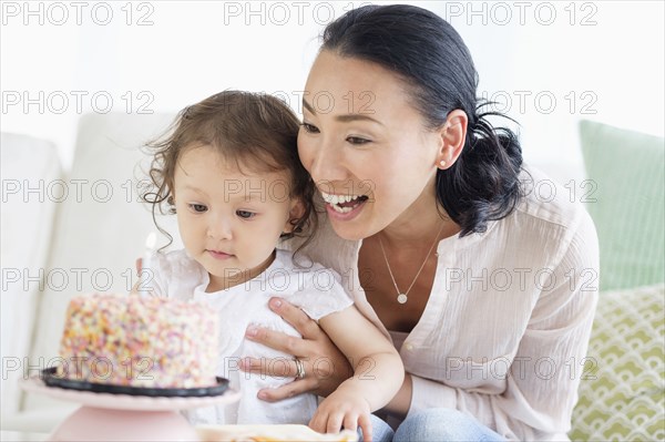 Mother and baby daughter celebrating birthday