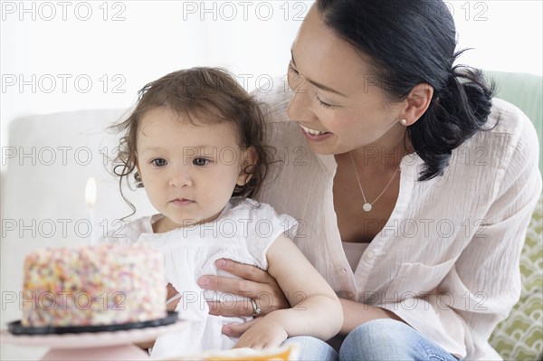 Mother and baby daughter celebrating birthday