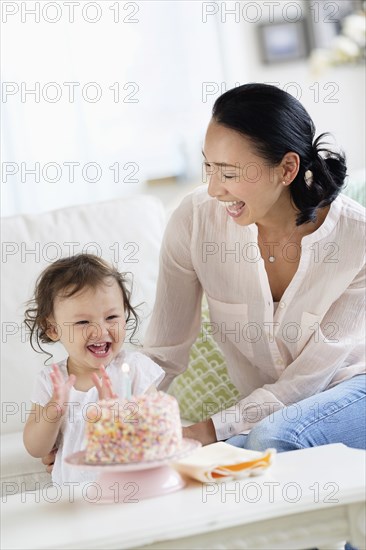 Mother and baby daughter celebrating birthday