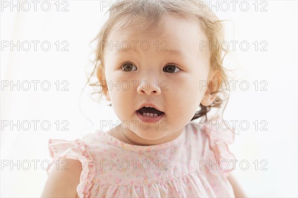 Mixed race baby girl with mouth open