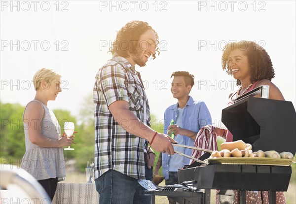 Friends talking at barbecue