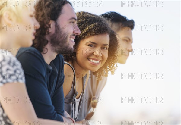 Woman smiling with friends outdoors