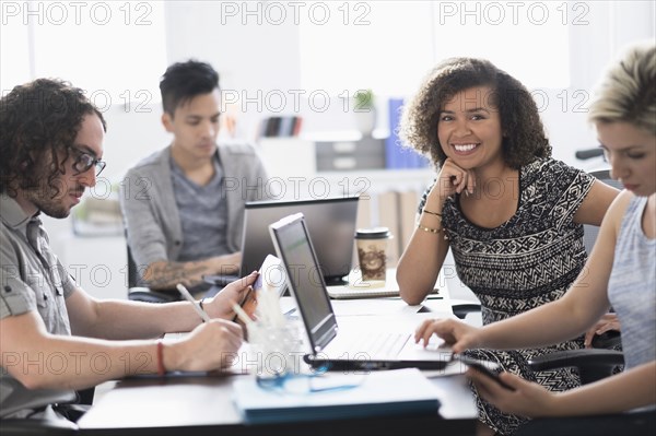 Businesswoman smiling in meeting