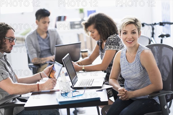 Businesswoman smiling in meeting