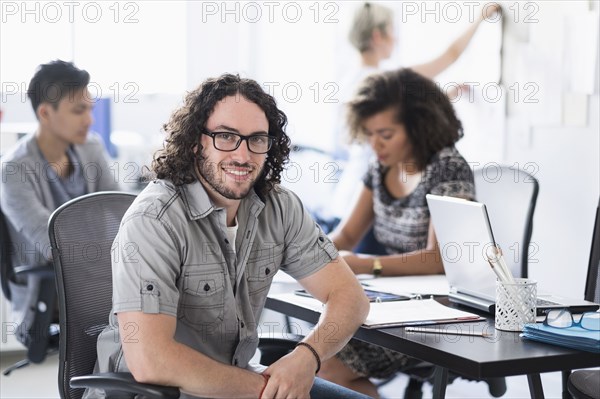 Businessman smiling in meeting