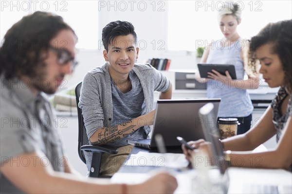 Businessman smiling in meeting